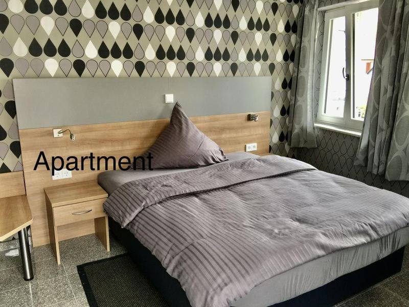 Postel nebo postele na pokoji v ubytování Hotel Mythos "Apartments"