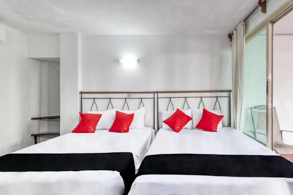 Postel nebo postele na pokoji v ubytování Hotel San Carlos