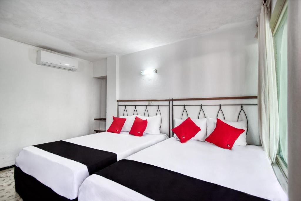 Postel nebo postele na pokoji v ubytování Hotel San Carlos