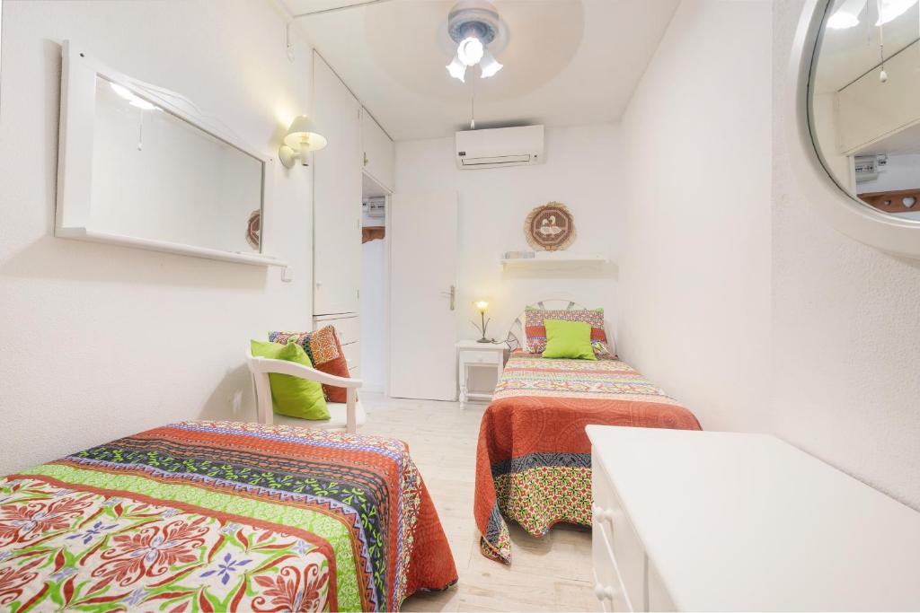 A bed or beds in a room at Apartamento 23 Edificio Canopus