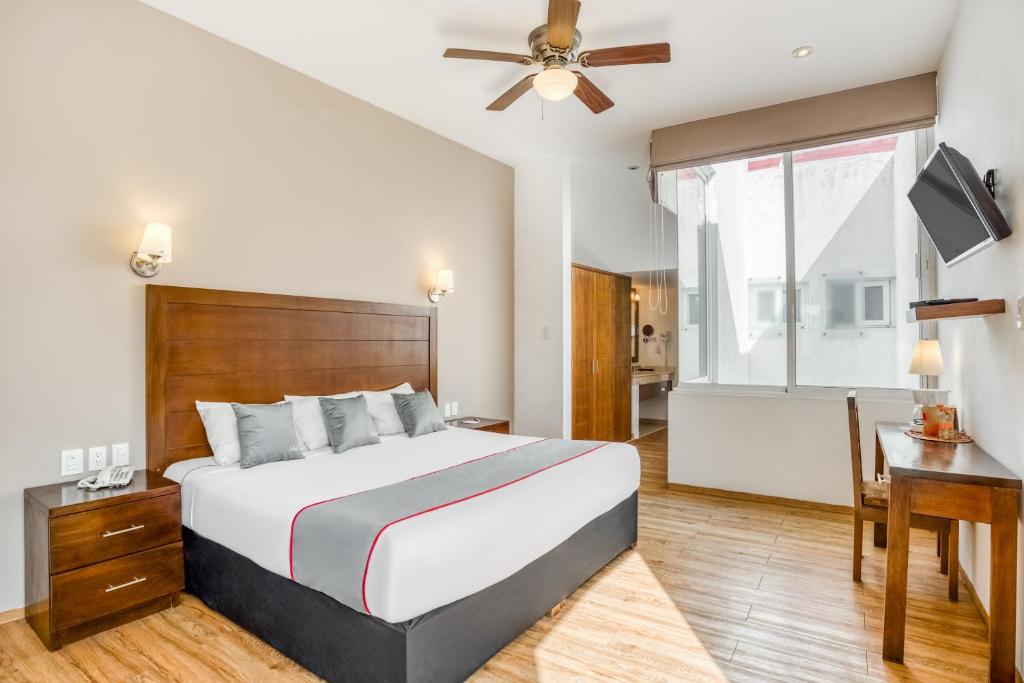 Una cama o camas en una habitación de Hotel Quinta Allende