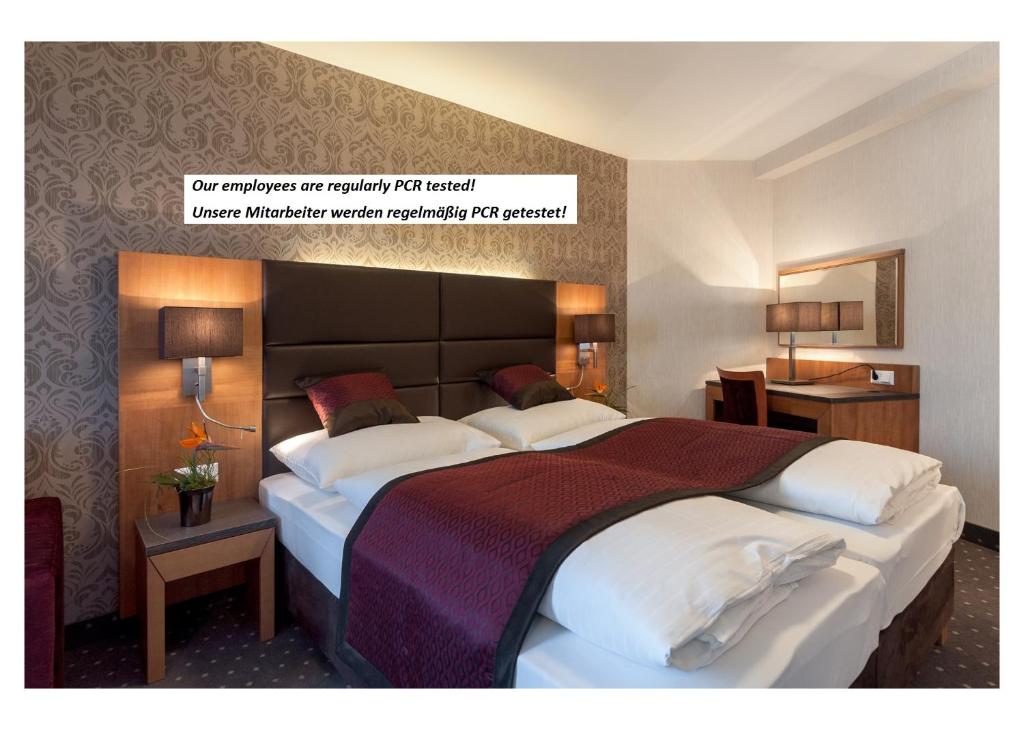 
A bed or beds in a room at Club Hotel Cortina
