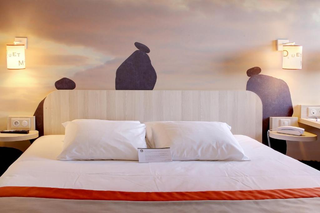 Postel nebo postele na pokoji v ubytování Best Western Auray le Loch