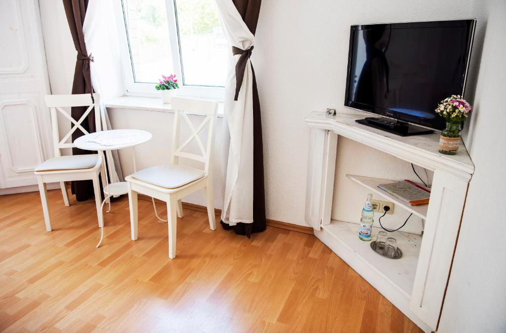 TV a/nebo společenská místnost v ubytování Pension Bertha