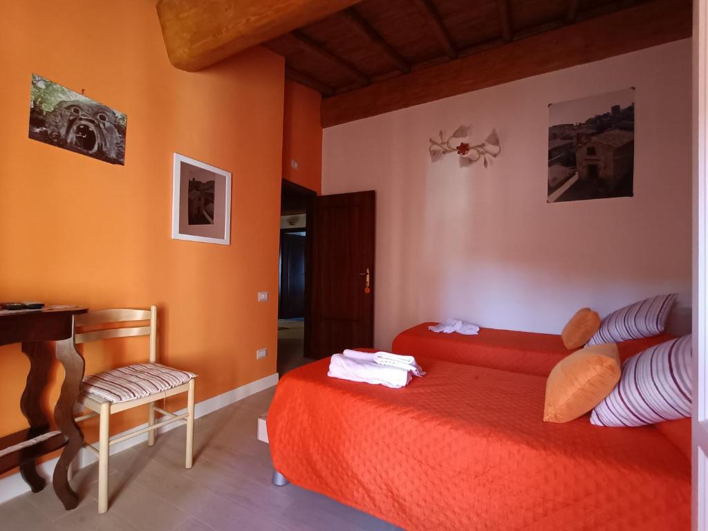 Letto o letti in una camera di B&B Il Grifo