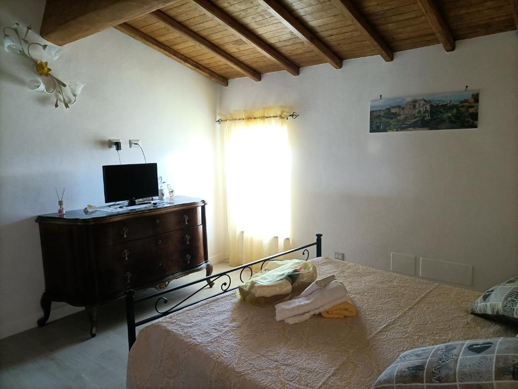 Letto o letti in una camera di B&B Il Grifo