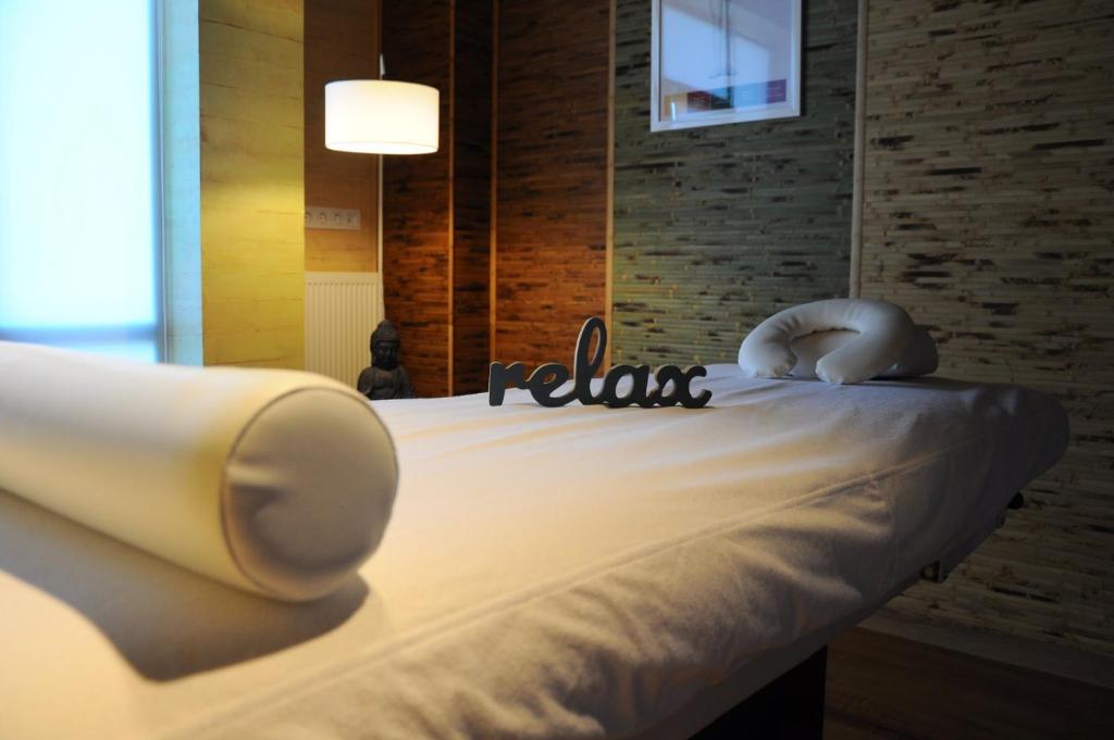 Postel nebo postele na pokoji v ubytování Alice Place Hotel