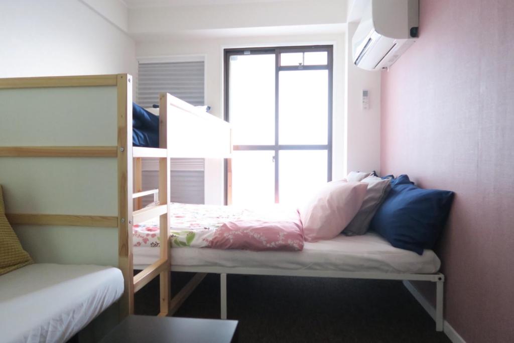 Giường trong phòng chung tại Maison de Soleil - Vacation STAY 9577