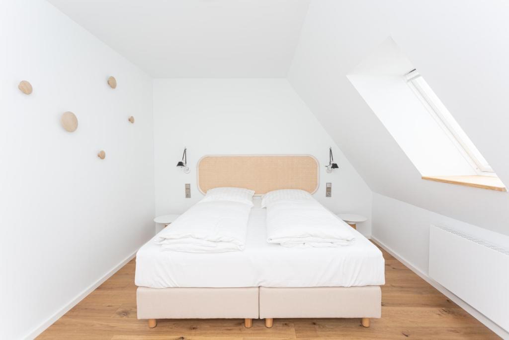 Postel nebo postele na pokoji v ubytování Hotel Hansenhof