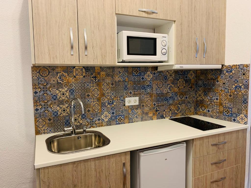 Kuchyňa alebo kuchynka v ubytovaní Apartamentos La Casa del Azafrán