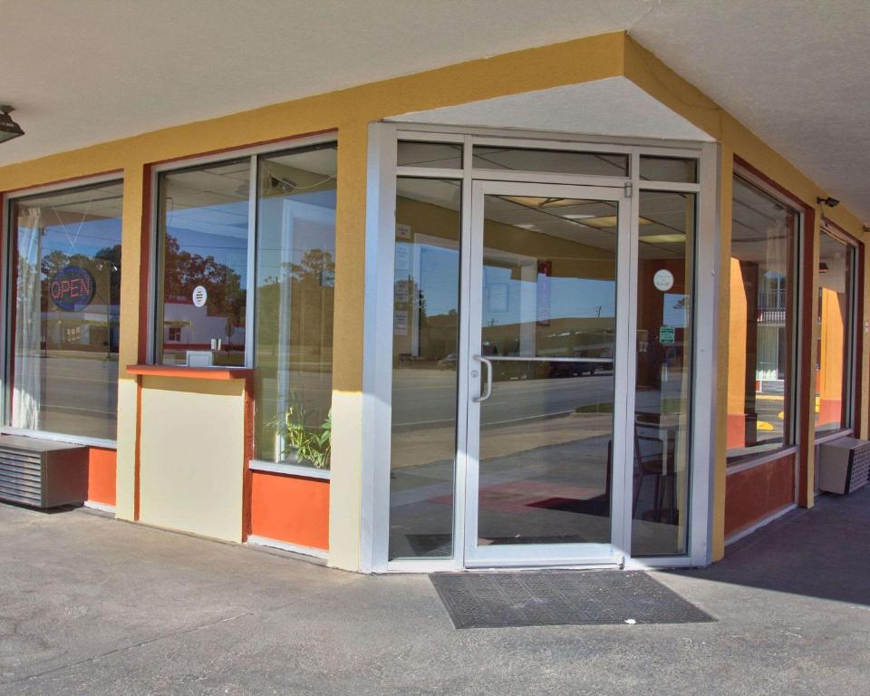 an entrance to a building with glass doors at Econo Lodge in Donalsonville