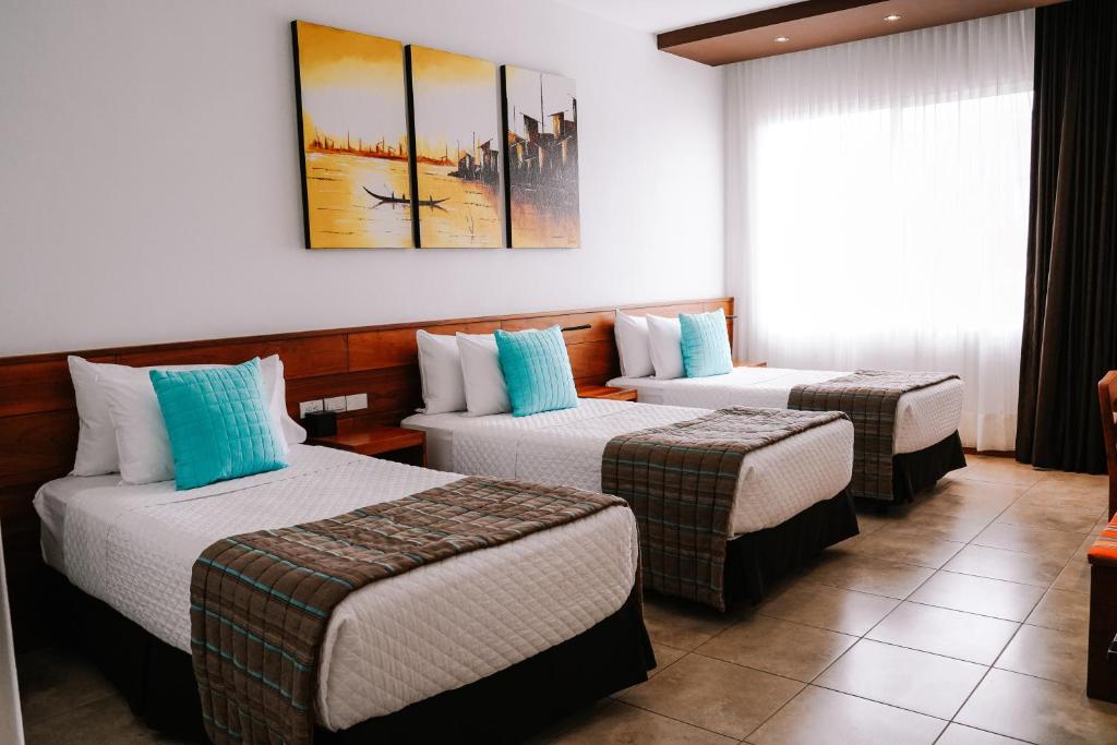 Postel nebo postele na pokoji v ubytování Hotel Cucuve
