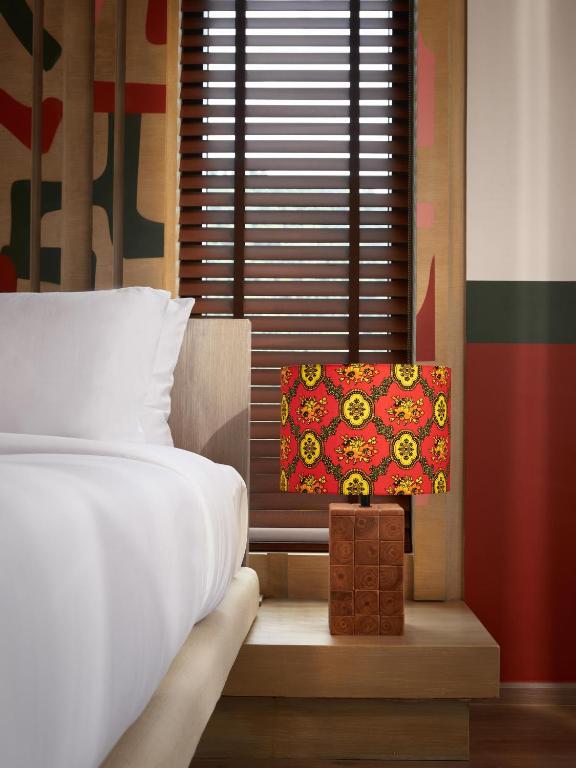 Postel nebo postele na pokoji v ubytování The Peri Hotel Khao Yai
