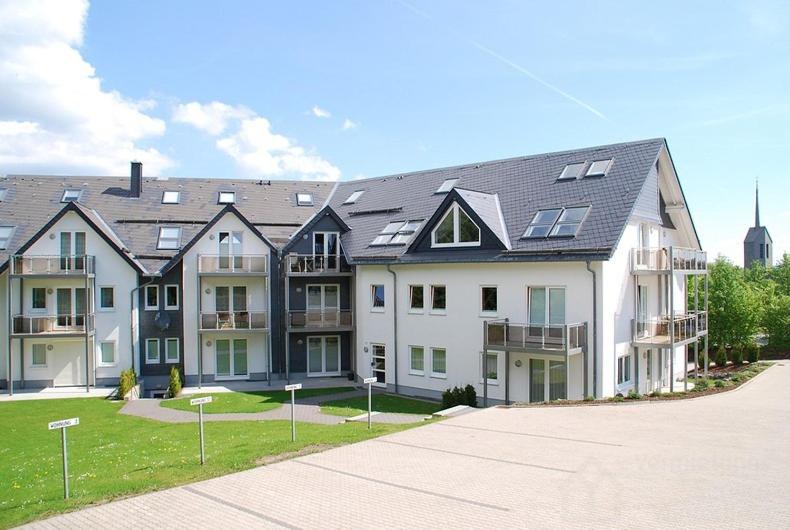 a large white apartment building with a lot of windows at Apartment Im Hohlen Seifen 10-H in Winterberg