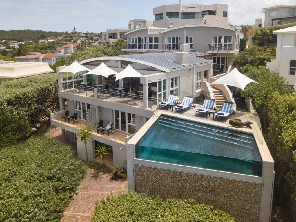an aerial view of a house with a swimming pool at Periwinkle Lodge Guest House in Plettenberg Bay