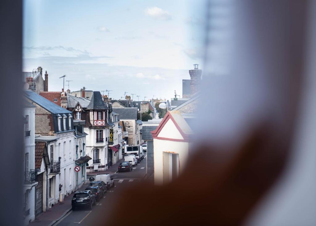 a view from a window of a city street at YOU Are Deauville in Deauville