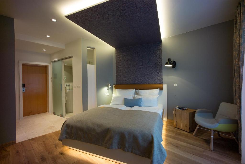 Postel nebo postele na pokoji v ubytování Hotel Gude