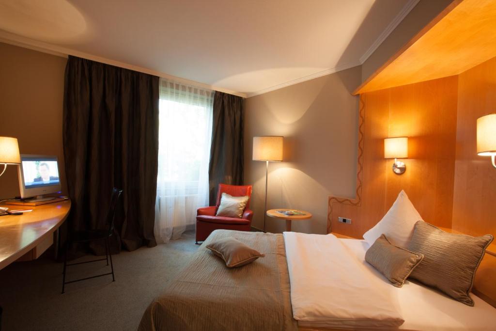 Postel nebo postele na pokoji v ubytování Hotel Gude
