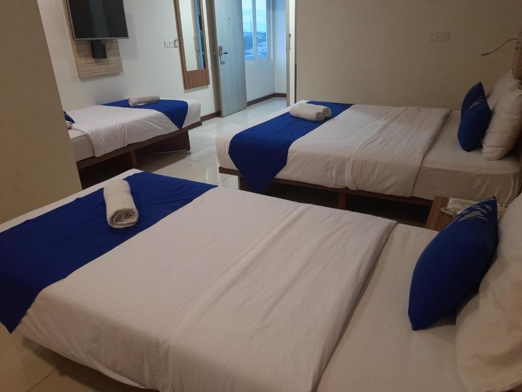 Postel nebo postele na pokoji v ubytování Smarthomm Ancol Jakarta