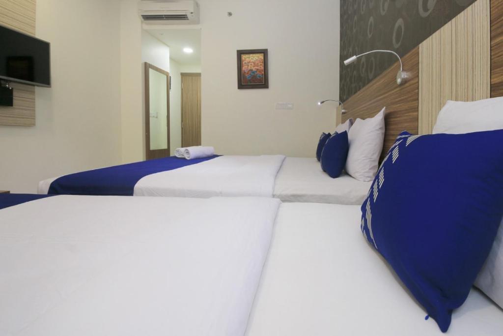 Postel nebo postele na pokoji v ubytování Smarthomm Ancol Jakarta
