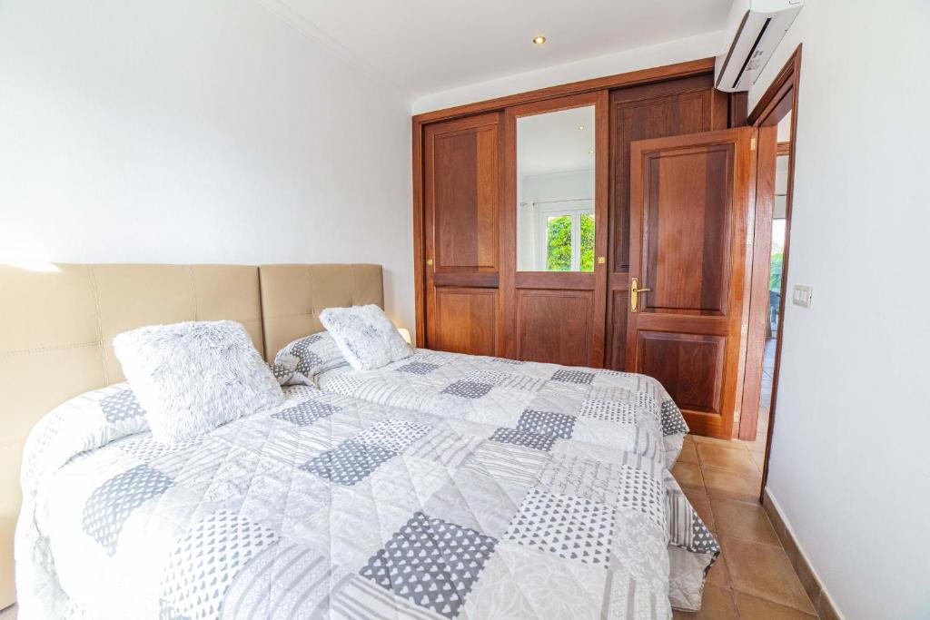 A bed or beds in a room at Finca SON SERRA Buger by Mallorca Villa Selection