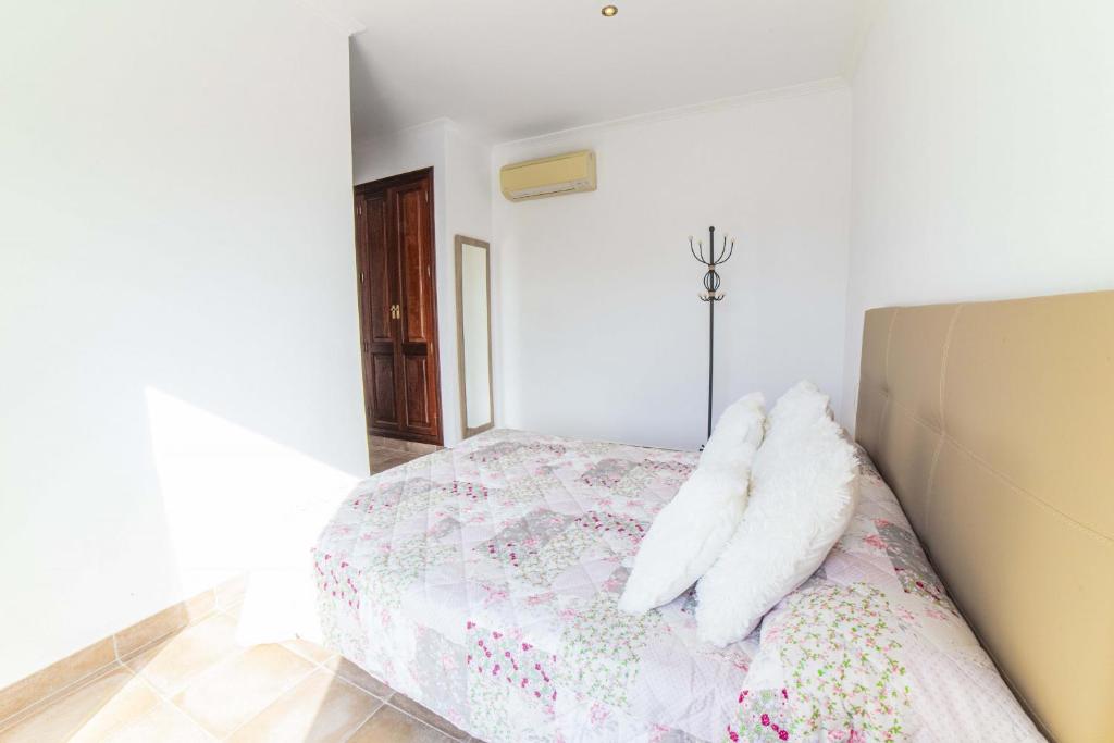 A bed or beds in a room at Finca SON SERRA Buger by Mallorca Villa Selection