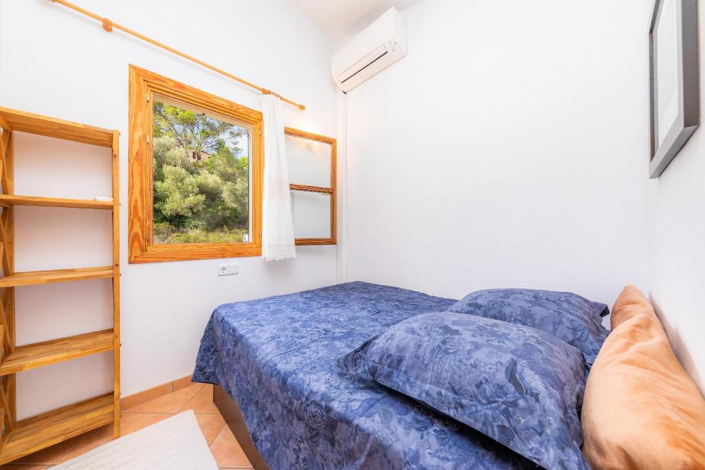 Postel nebo postele na pokoji v ubytování Son Llodra