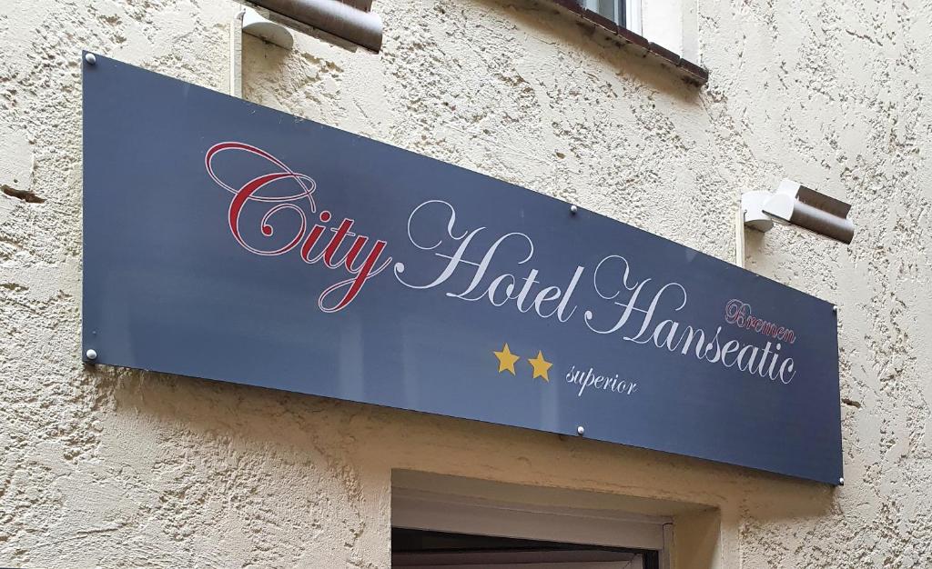 a blue sign on the side of a building at City Hotel Hanseatic Bremen in Bremen