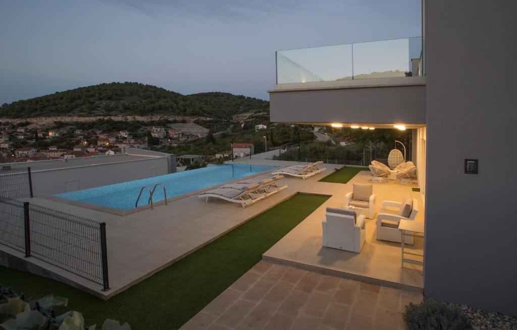 a house with a swimming pool on top of it at Luxury Blue Villas Vis in Vis