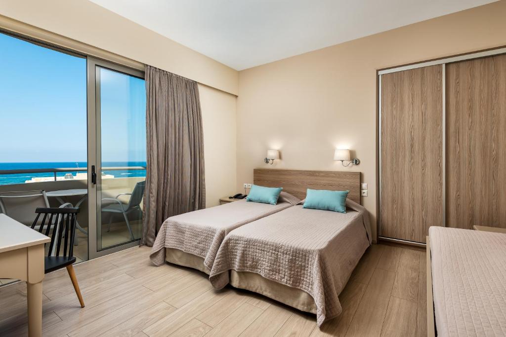 Postel nebo postele na pokoji v ubytování Icarus Apartments