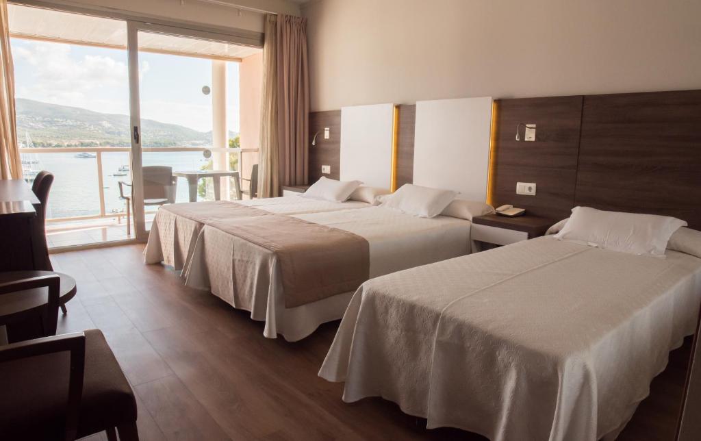 Postel nebo postele na pokoji v ubytování Seramar Hotel Comodoro Playa