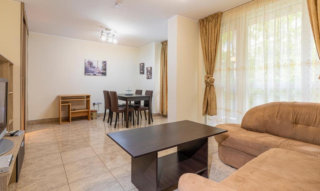 a living room with a couch and a table at 1BD apartment in a calm area near the centre in Plovdiv