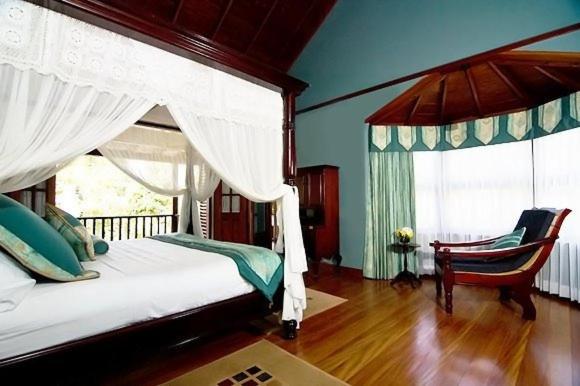 Postel nebo postele na pokoji v ubytování Spring Hotel Bequia