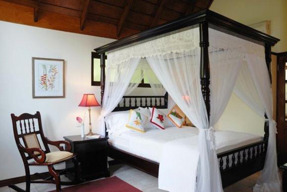 Postel nebo postele na pokoji v ubytování Spring Hotel Bequia