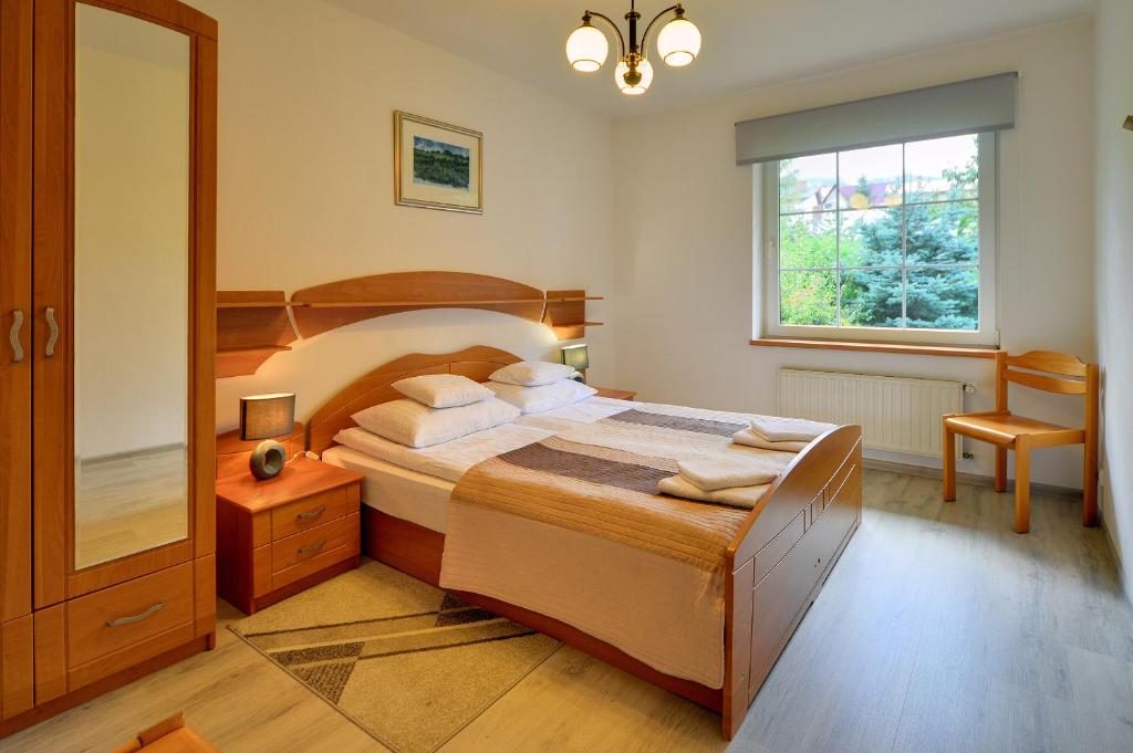 Posteľ alebo postele v izbe v ubytovaní ApartamentVanessa