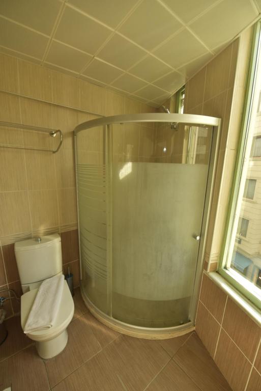A bathroom at Omega Luxx Hotel
