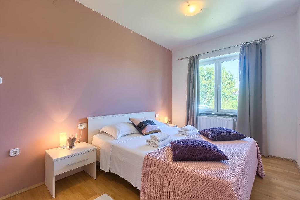 Postel nebo postele na pokoji v ubytování Villa Nina