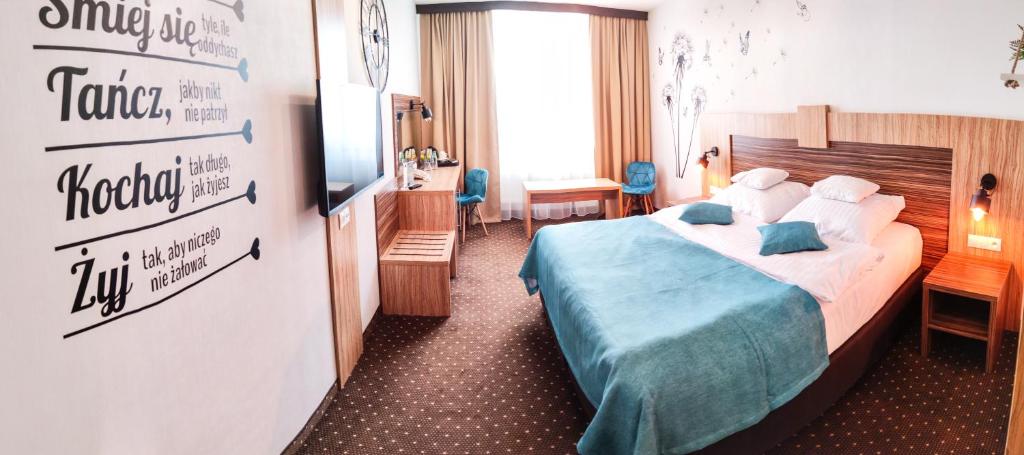 Postel nebo postele na pokoji v ubytování Hotel Milenium