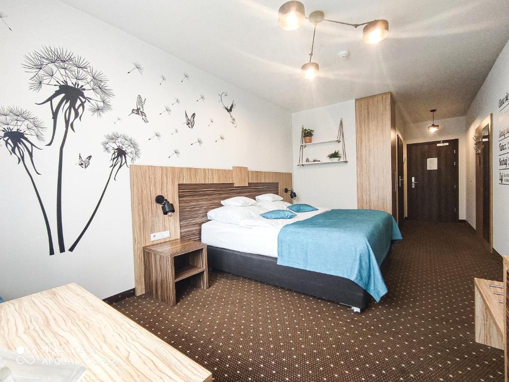 Postel nebo postele na pokoji v ubytování Hotel Milenium