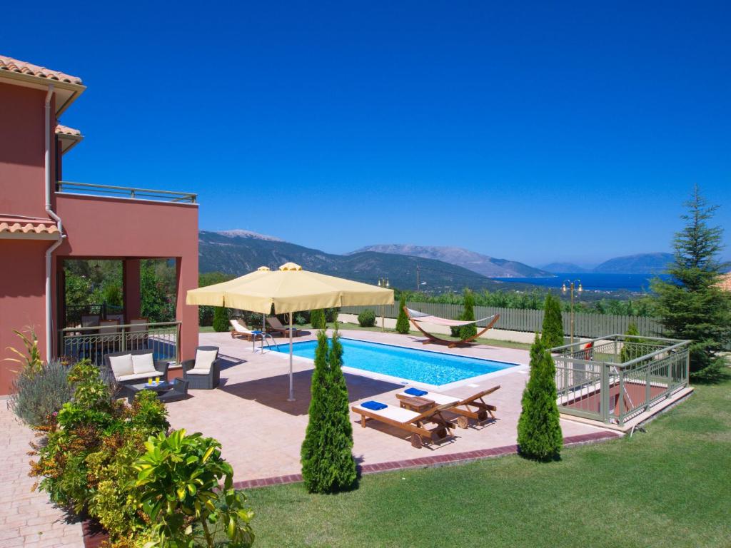 a villa with a swimming pool and a house at Villa Nireaus in Chaliotata