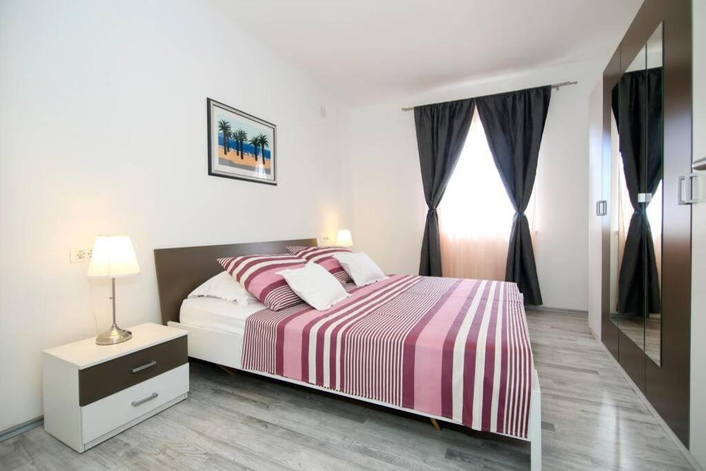 Posteľ alebo postele v izbe v ubytovaní Apartman BUKI ****