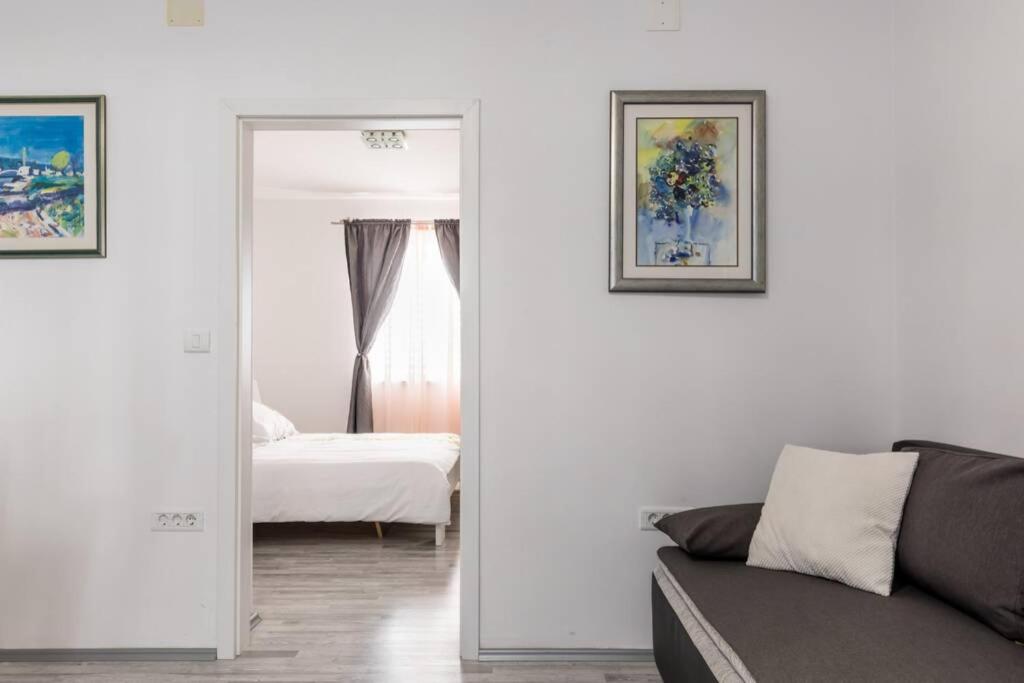 Posteľ alebo postele v izbe v ubytovaní Apartman BUKI ****