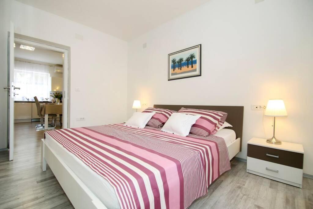 Posteľ alebo postele v izbe v ubytovaní Apartman BUKI ****
