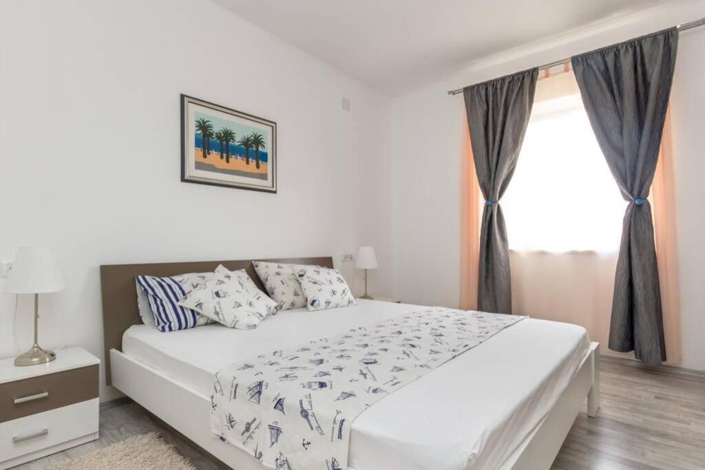 Posteľ alebo postele v izbe v ubytovaní Apartman BUKI ****