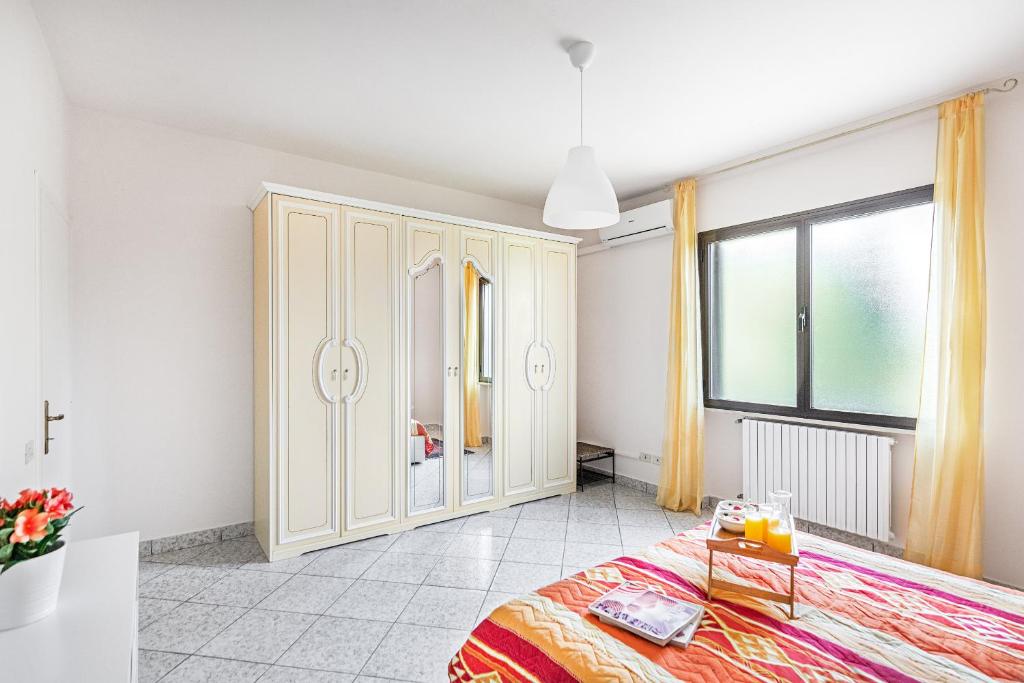 Łóżko lub łóżka w pokoju w obiekcie Villa Alma