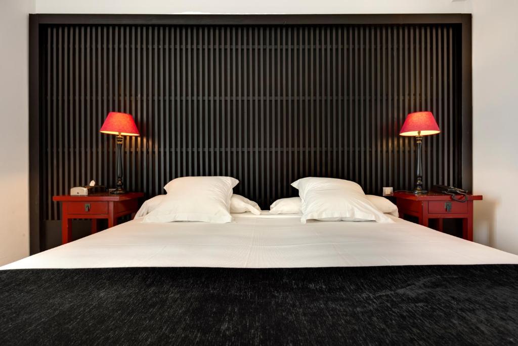 A bed or beds in a room at Hotel Market
