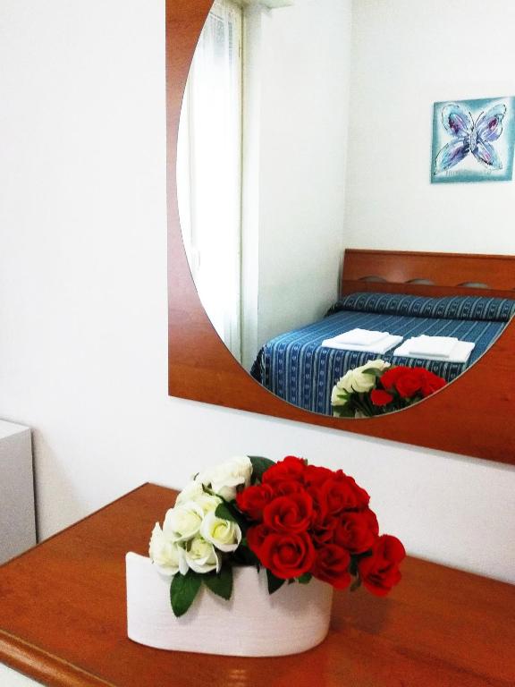 Postel nebo postele na pokoji v ubytování Albergo Athena