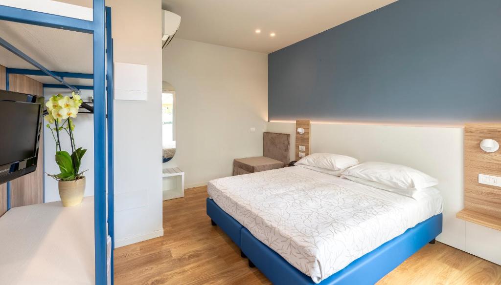Postel nebo postele na pokoji v ubytování Hotel Gemma
