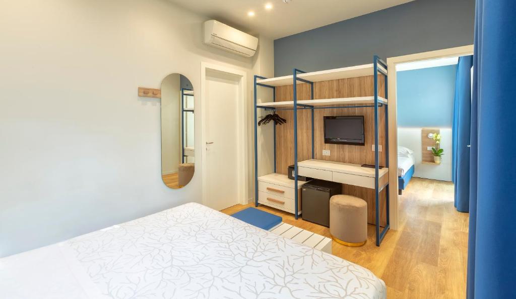Postel nebo postele na pokoji v ubytování Hotel Gemma