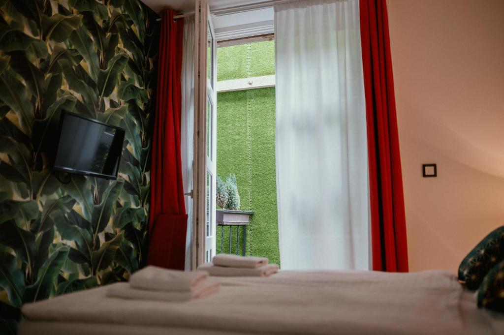 Postel nebo postele na pokoji v ubytování Boutique Hotel Annuska